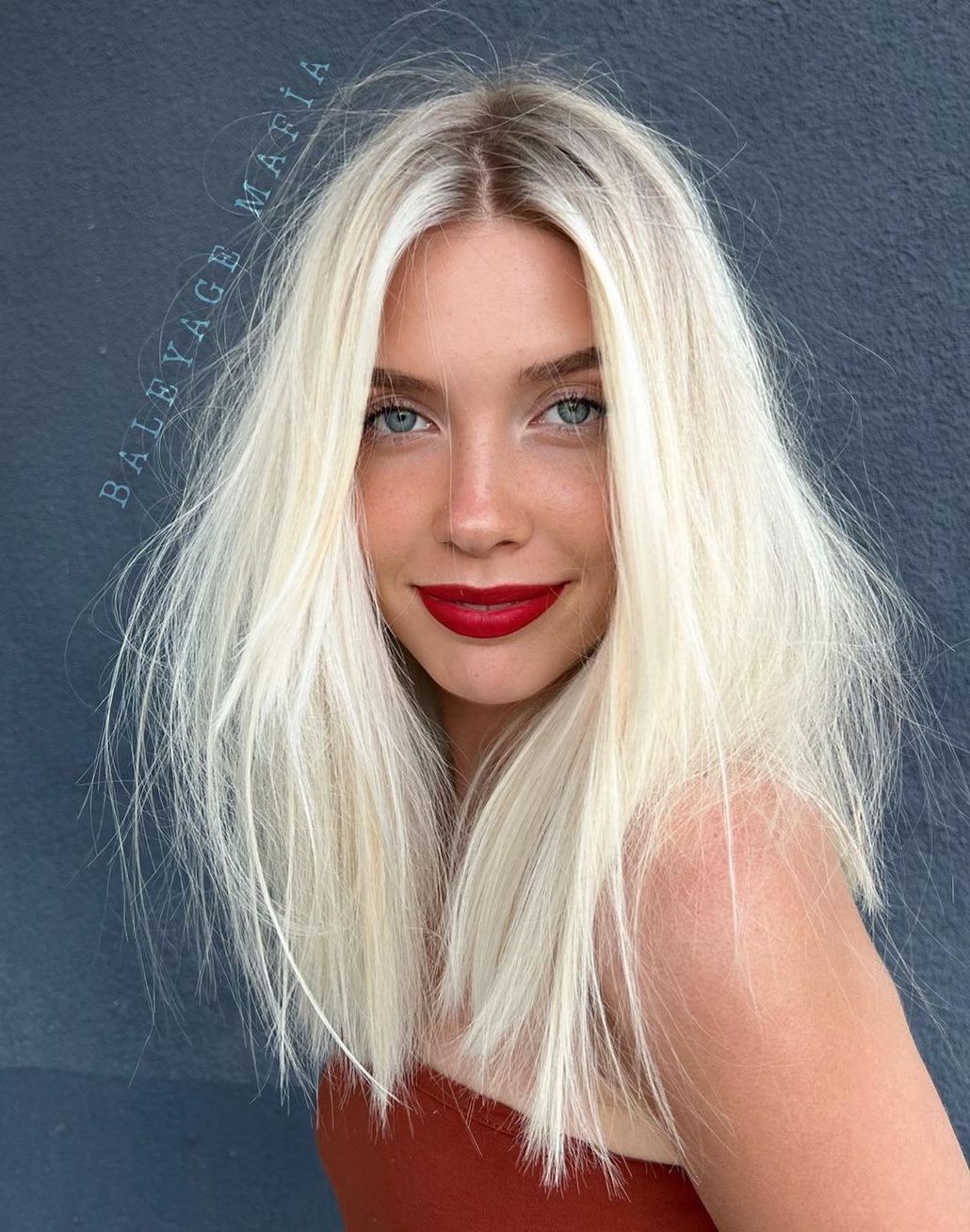 Wispy White Blonde Shag with Shadow Roots